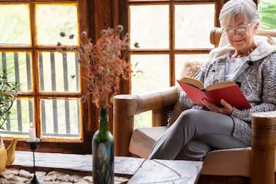 senior woman reading a book