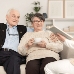Senior Couple sitting together on a couch