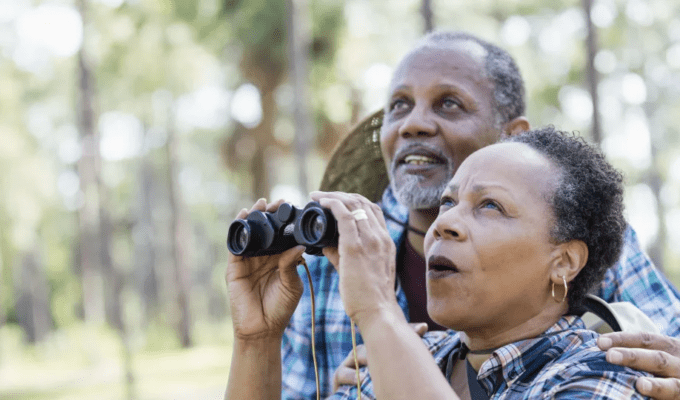 People looking through binoculars