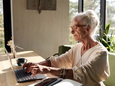 An old person using a computer