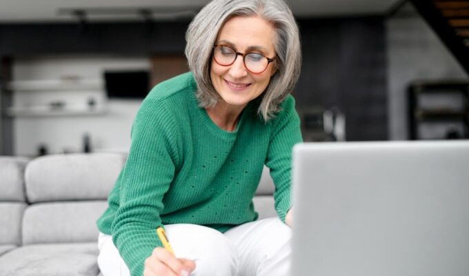 A woman writing something down