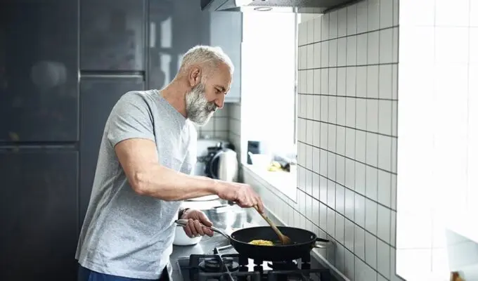 A person cooking in a kitchen