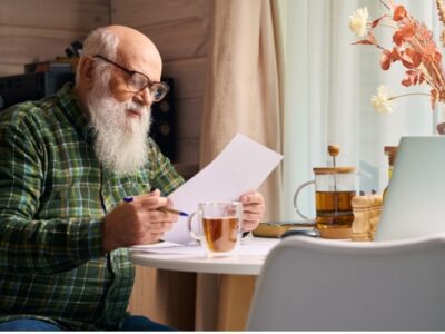Old man reading a paper
