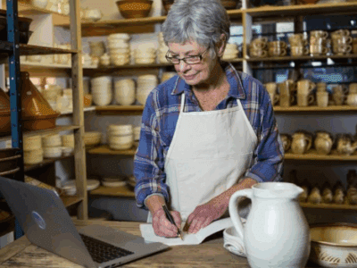 A person writing on a paper