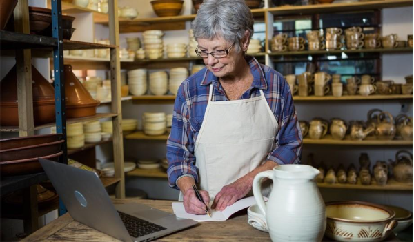 A person writing on a paper